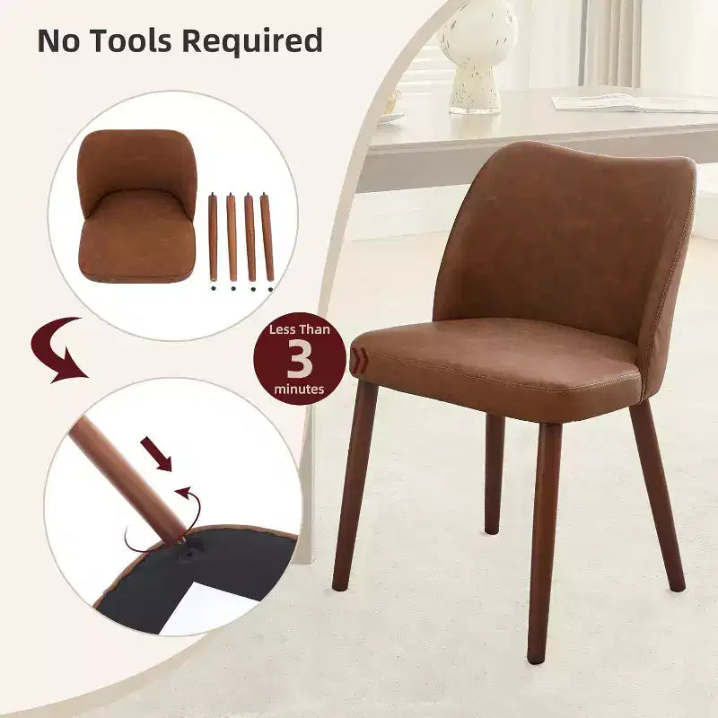 Sedia da pranzo rivestita in pelle con gambe in legno e schienale a orecchioni